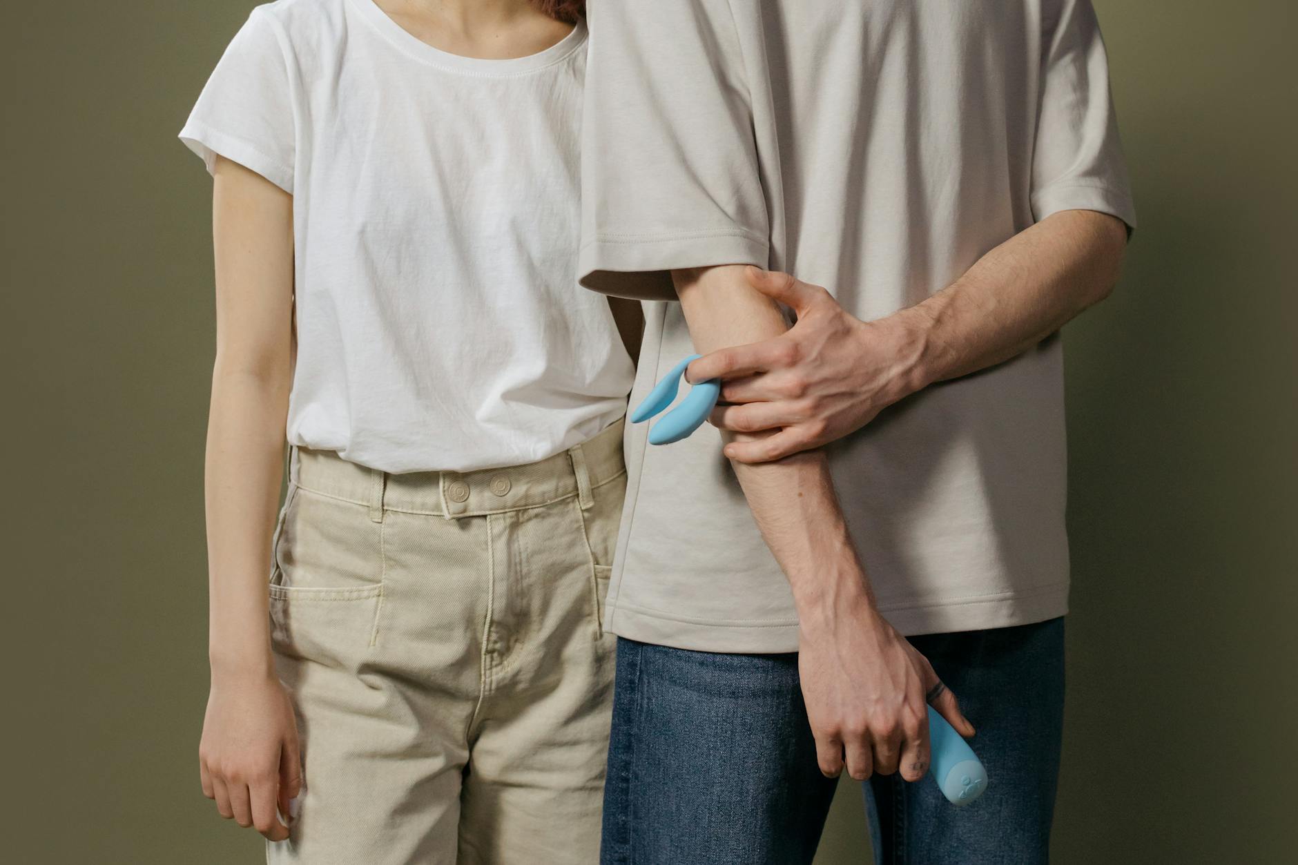A couple holding each other with confidence and comfort indoors