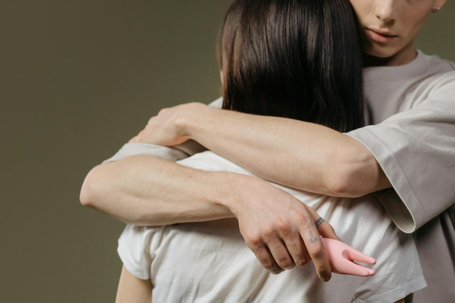 Close-up of a couple embracing with intentional physical connection and presence